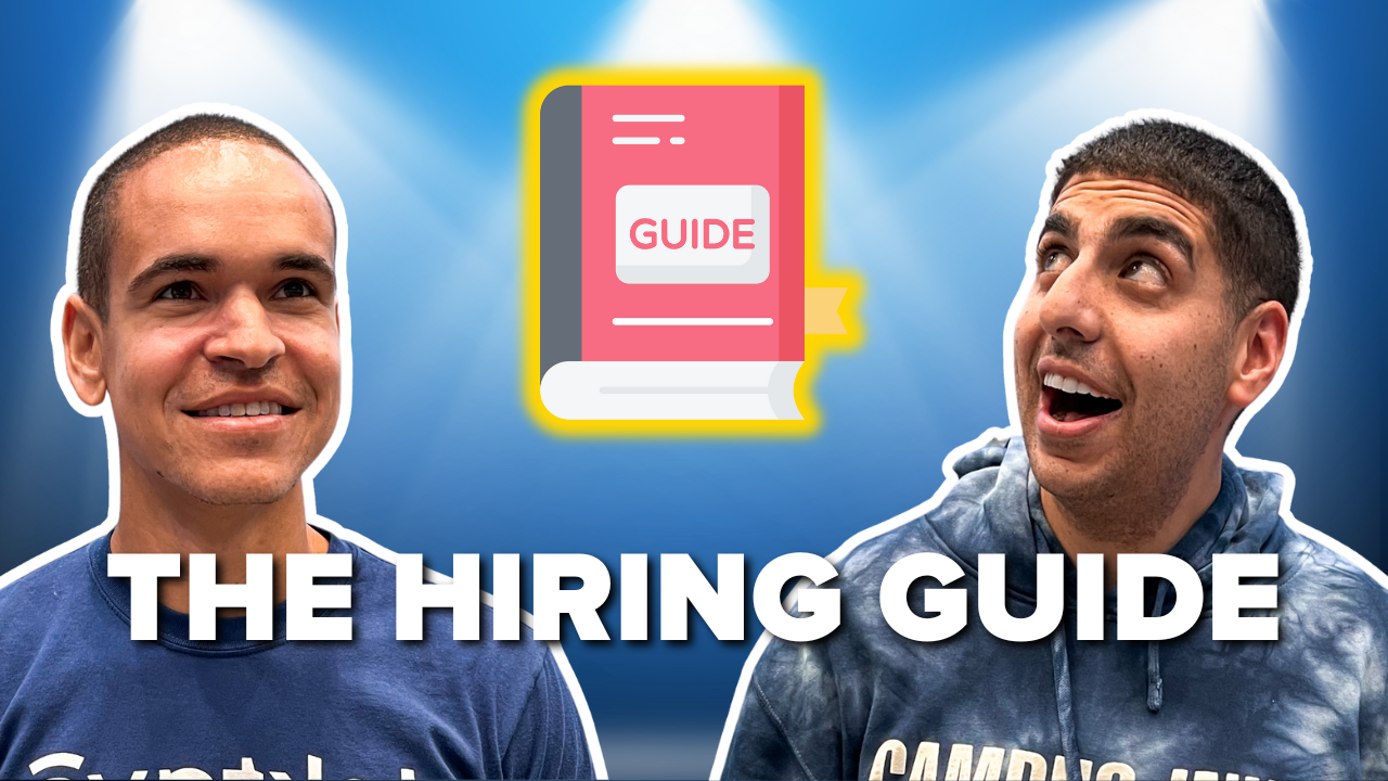 Photo of Steven Farag and Bruce Ackerman looking at a Hiring Guide